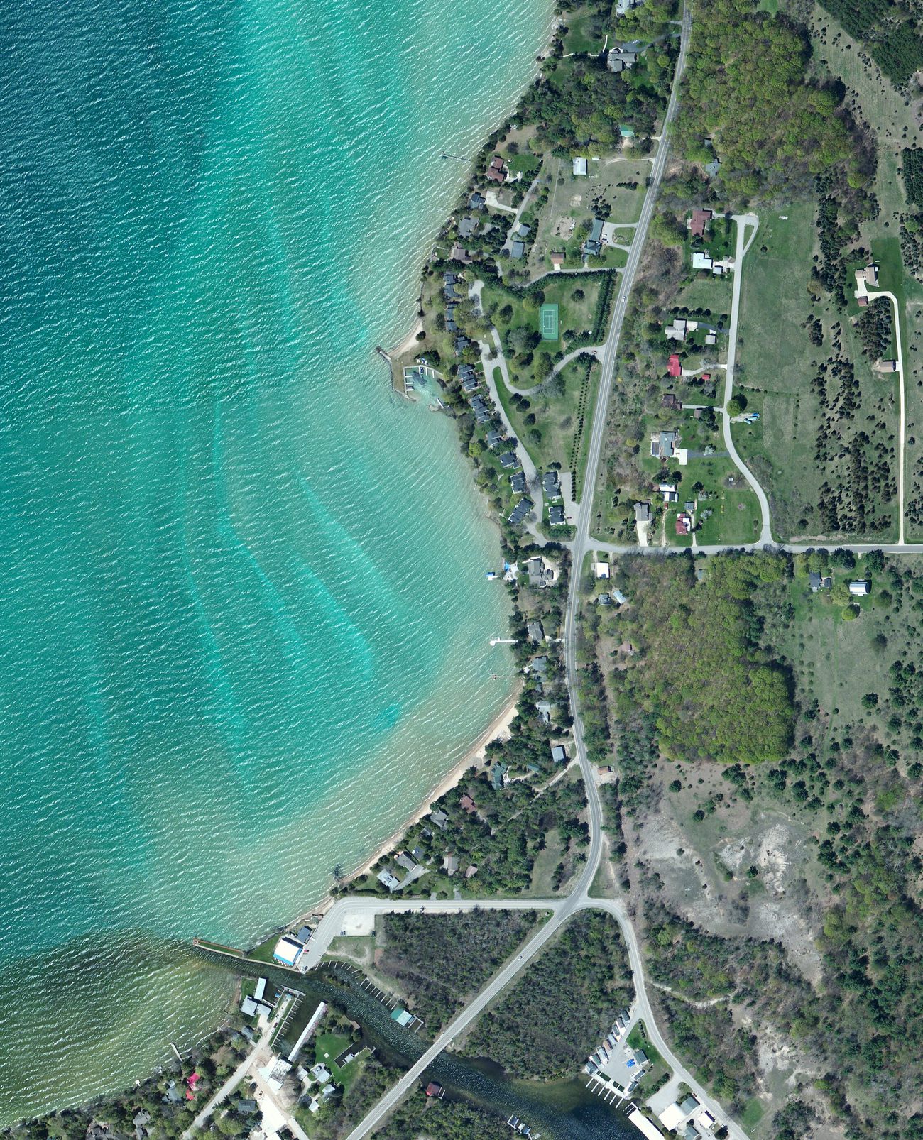 Wide 2014 aerial of the same area: the borrow pit freshly scraped, bare earth.